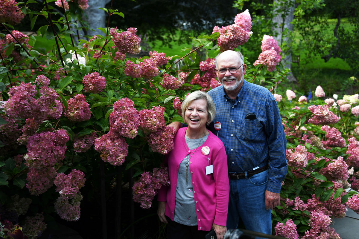 063 Kathie and Ron Klute pose among the hydrangeas.jpg
